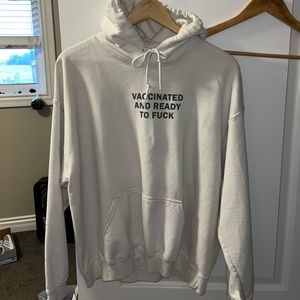 White hoodie. Size L. Signage: VACCINATED AND READY TO FUCK.
